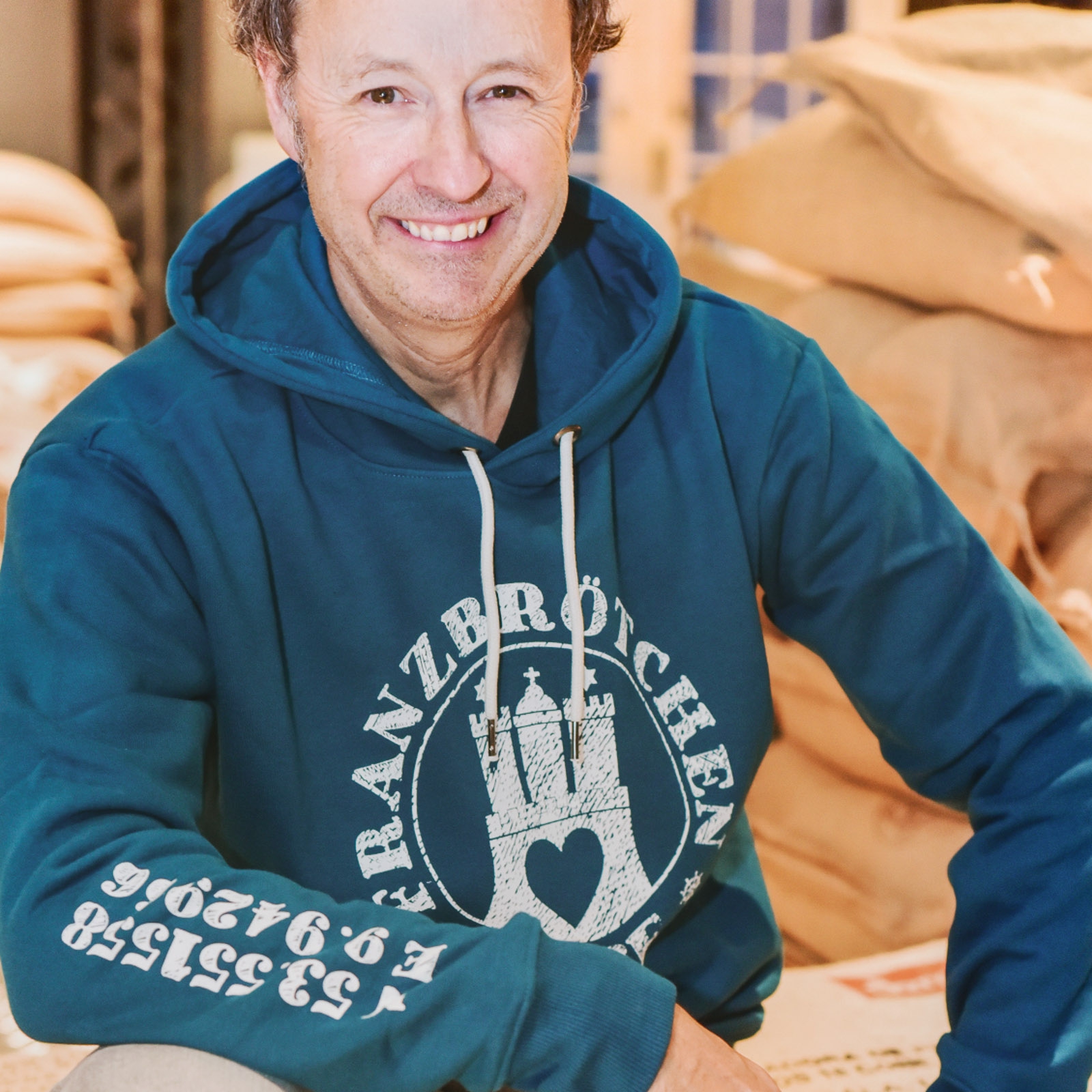 Franzbrötchenliebe Hoodie unisex - Lyons Blue türkis mit weißem Print