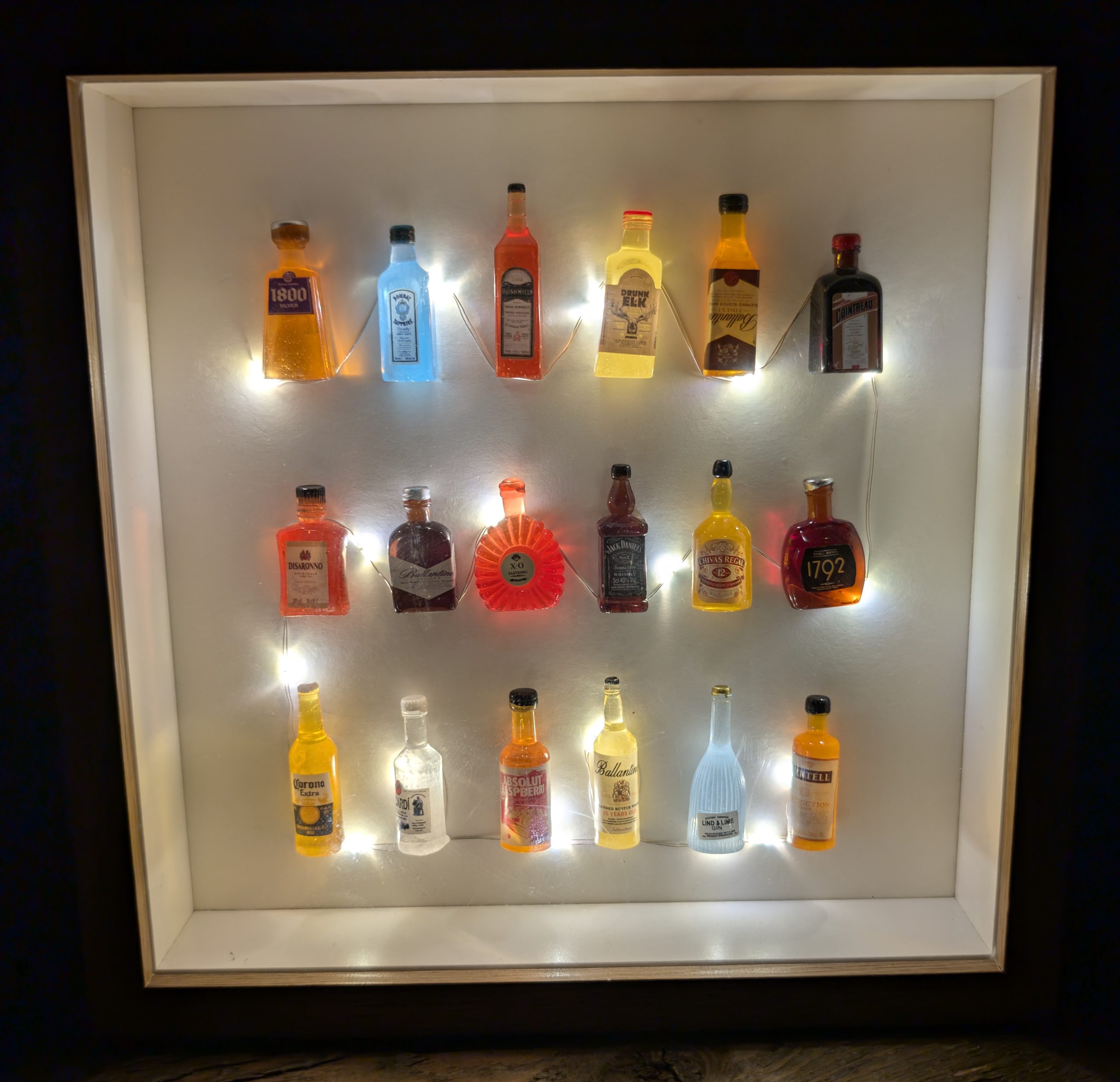 Illuminated Miniature Bottles in a Frame